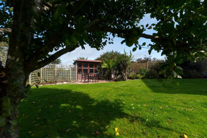 Family and pet friendly home sleeping up to 10, located within walking distance of the beach