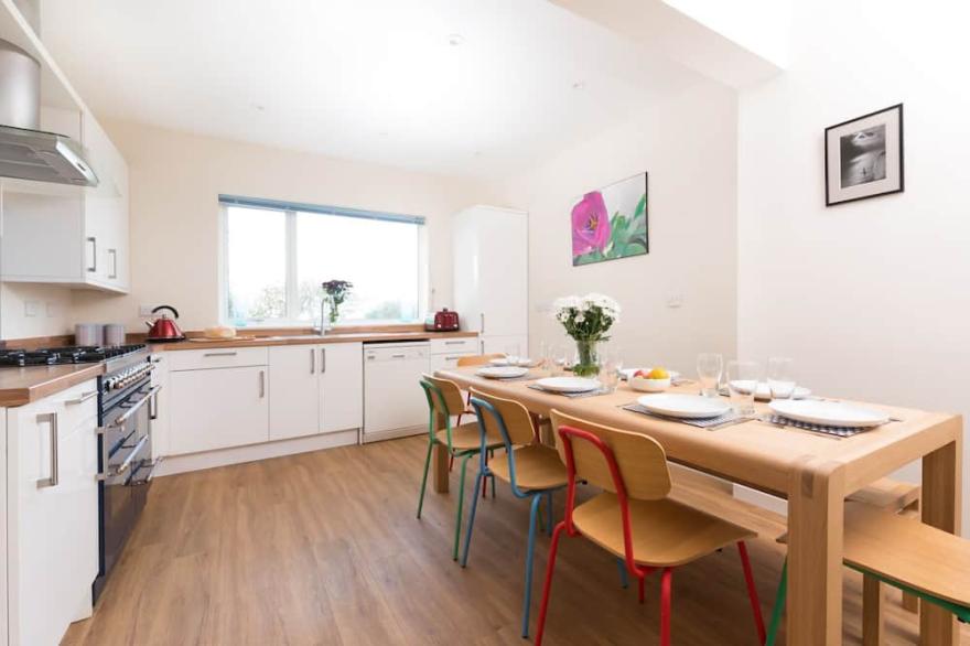 Family and pet friendly home sleeping up to 10, located within walking distance of the beach