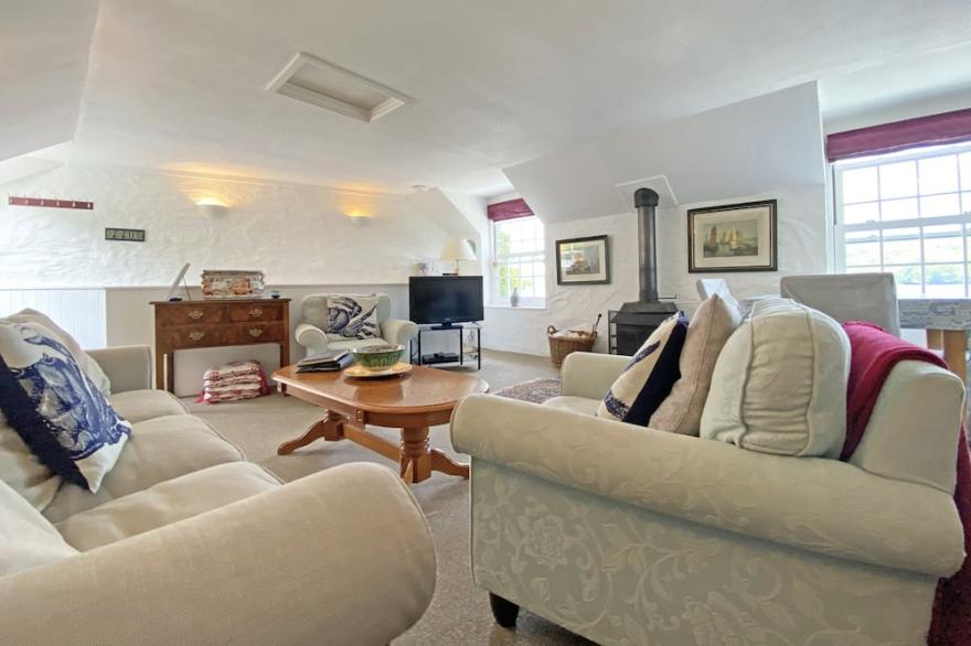Idyllic cottage with log fires and private riverside terrace on Fowey Estuary