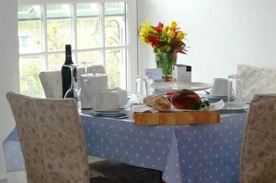 Idyllic cottage with log fires and private riverside terrace on Fowey Estuary