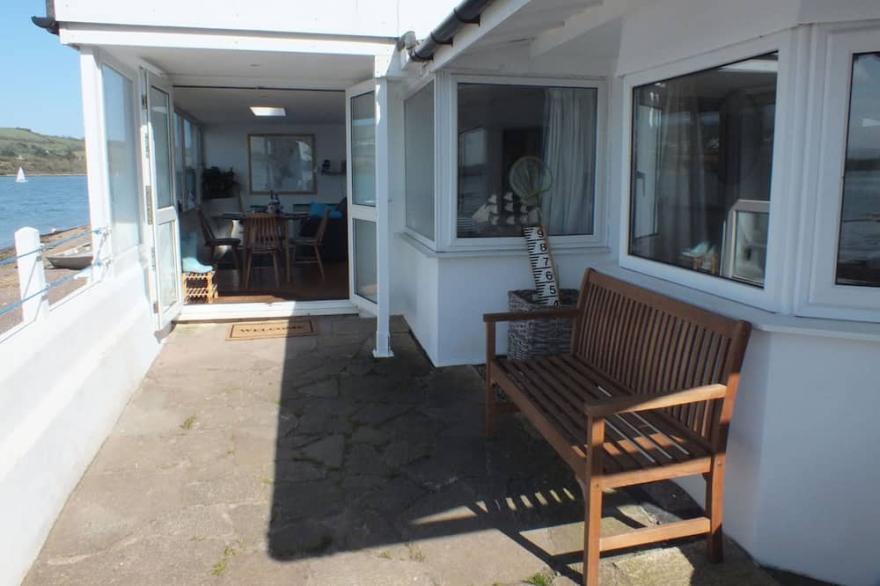 Charming cottage right on the river bank with fabulous views.