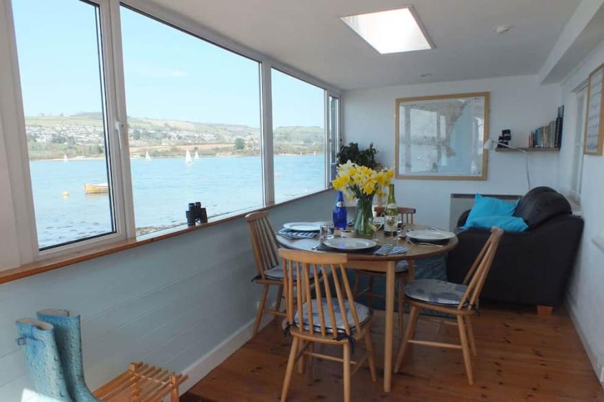 Charming cottage right on the river bank with fabulous views.