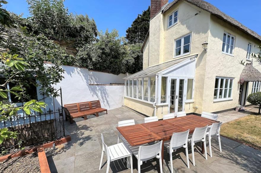 Shepherds Patch Is A Large Thatched Cottage In Thurlestone with a parking space.