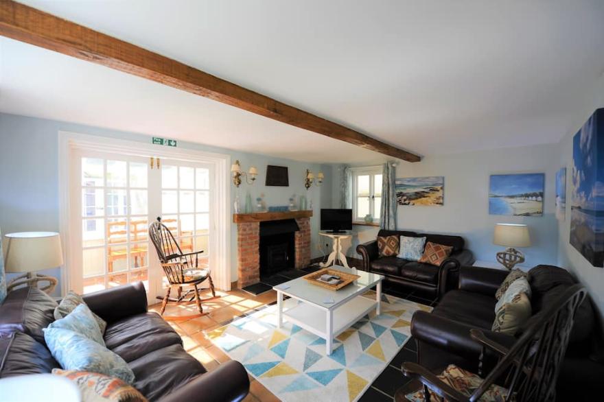 Shepherds Patch Is A Large Thatched Cottage In Thurlestone with a parking space.