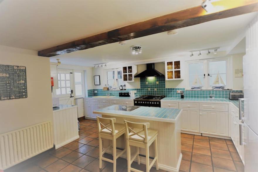 Shepherds Patch Is A Large Thatched Cottage In Thurlestone with a parking space.