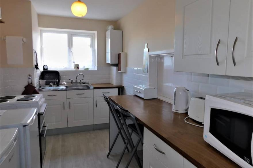 1 Driftway Court - a well-appointed ground floor apartment, featuring open plan living/dining room.
