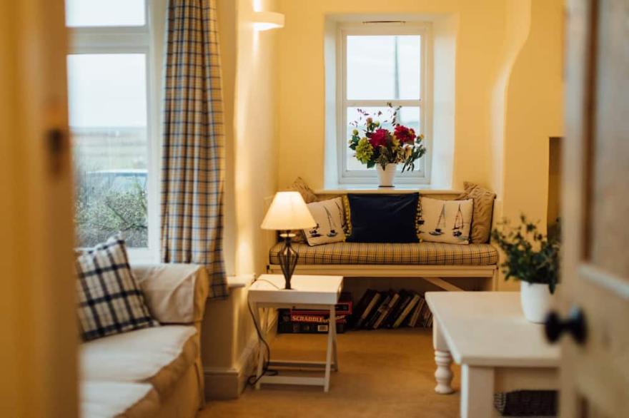 Gorgeous flint cottage overlooking the marshes, walking distance to beach