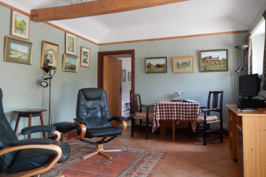 Sunny Cottage over-looking part of a Large Garden, in rural surroundings.