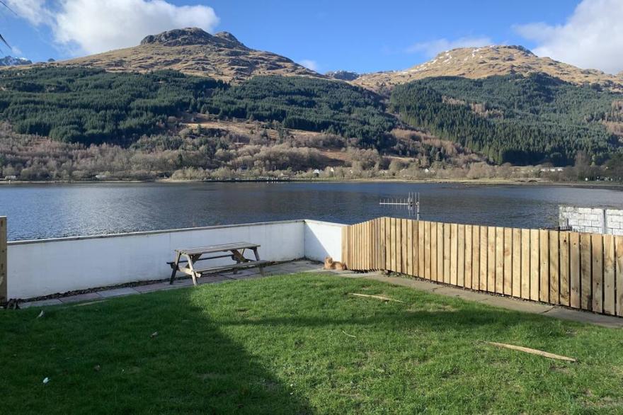 Situated in Lomond Park on the shore of Loch Long with amazing views
