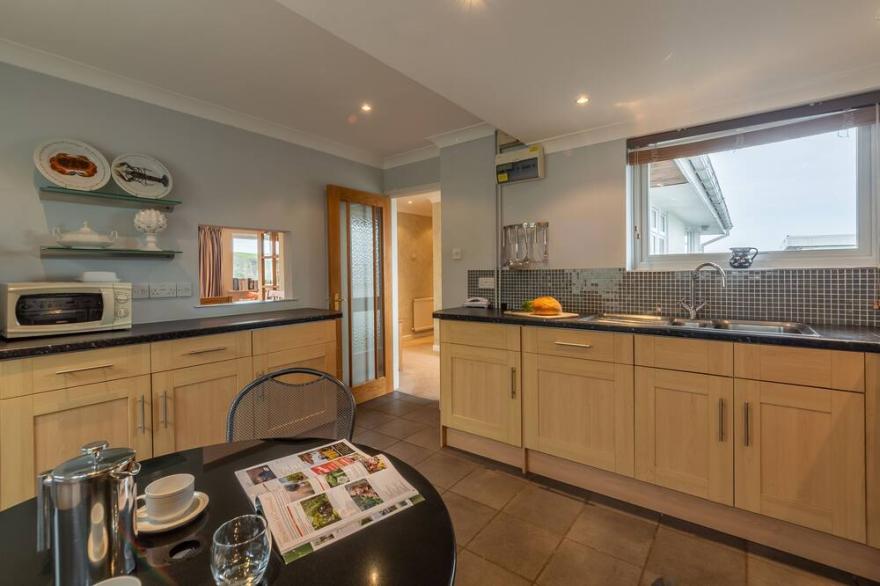Silvershells is a three bedroom bungalow with outstanding harbour views.