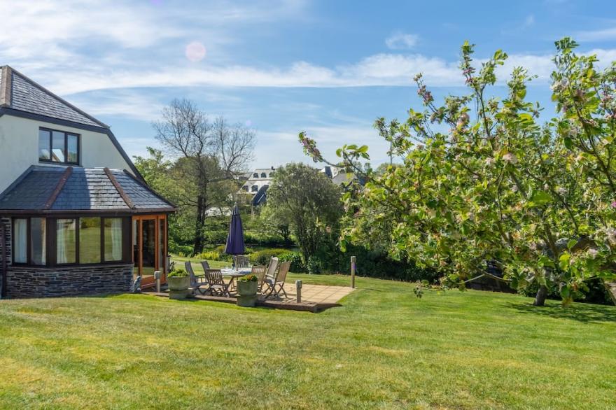 Overlooking the lakes of Roserrow, April Cottage is in an enviable location.