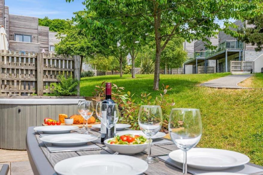 Stylish and contemporary pet friendly property featuring a wood-burning stove, patio hot tub and lar