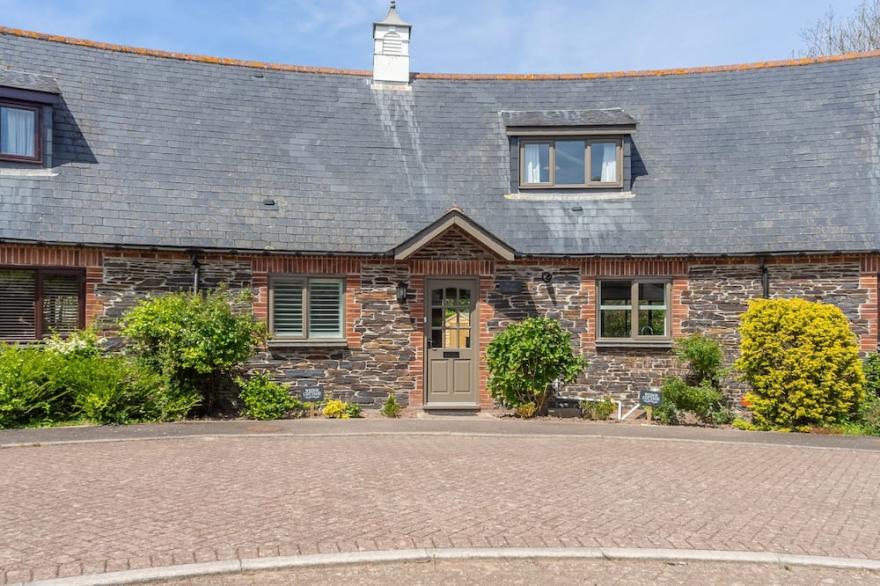 A stunning holiday home located in the Curved Stables at Roserrow.