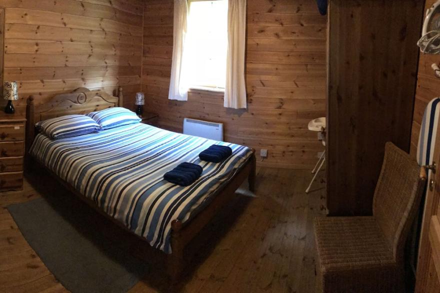 Self Catering Holiday Lodge set in 6 acres of wooded Hillside in South Wales