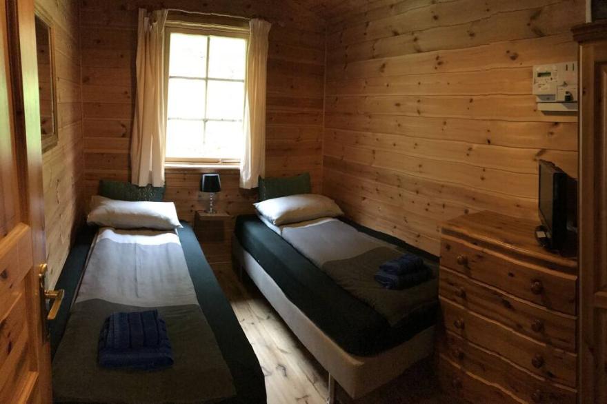 Self Catering Holiday Lodge set in 6 acres of wooded Hillside in South Wales