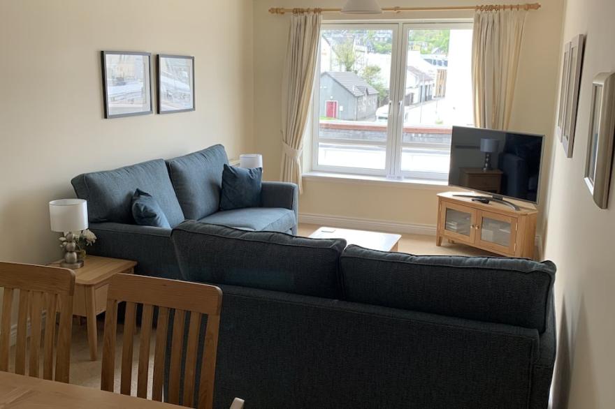 Central Oban Two bedroom apartment with lift access and private parking