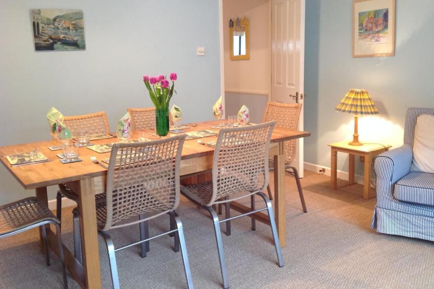 Charming seafront  home with garden on the Beach in unspoilt Seaside Village